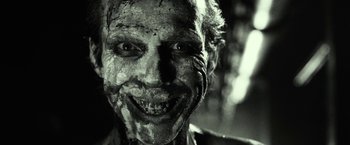 Movie still from “31” (2016), directed by Rob Zombie – A person's face covered in mud; Close Up shot, Low angle