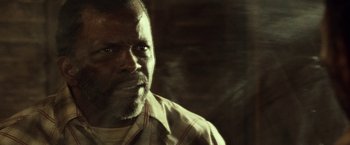 Movie still from “31” (2016), directed by Rob Zombie – A person wearing a plaid shirt; Close Up shot, Low angle