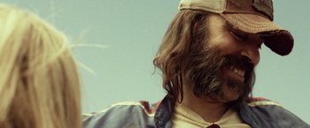 Movie still from “31” (2016), directed by Rob Zombie – A person with long hair and a beard; Close Up shot, Low angle