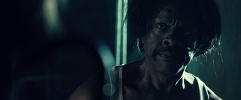 Movie still from “31” (2016), directed by Rob Zombie – A person with a beard; Close Up shot, Over the shoulder angle