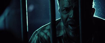 Movie still from “31” (2016), directed by Rob Zombie – A man's face in the dark; Close Up shot, Low angle