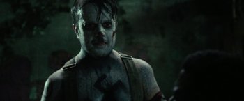 Movie still from “31” (2016), directed by Rob Zombie – A person with a clown makeup on; Close Up shot, Over the shoulder angle