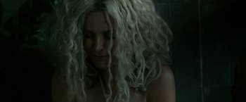 Movie still from “31” (2016), directed by Rob Zombie – A woman with long white hair is looking at the camera; Close Up shot, Overhead angle