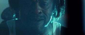 Movie still from “31” (2016), directed by Rob Zombie – A man's face in a dark room; Extreme Close Up shot, Low angle