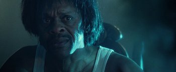 Movie still from “31” (2016), directed by Rob Zombie – An old man with a long hair and a beard; Close Up shot, Low angle