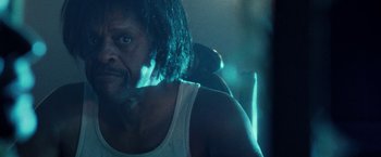 Movie still from “31” (2016), directed by Rob Zombie – A person with long black hair; Close Up shot, Low angle