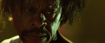 Movie still from “31” (2016), directed by Rob Zombie – A man's face in the dark; Extreme Close Up shot, Low angle