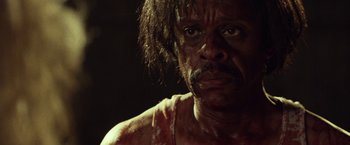 Movie still from “31” (2016), directed by Rob Zombie – A person with blood all over his face; Close Up shot, Low angle