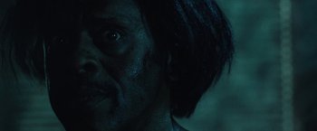 Movie still from “31” (2016), directed by Rob Zombie – A man's face in the dark; Close Up shot, Low angle