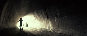 Movie still from “31” (2016), directed by Rob Zombie – A dark tunnel with light coming through it; Extreme Wide shot, Low angle