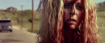 Movie still from “31” (2016), directed by Rob Zombie – A person with blood all over their face; Close Up shot, Low angle