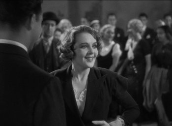 Movie still from “42nd Street” (1933), directed by Lloyd Bacon – An old photo of a man and a woman dancing; Medium shot, Over the shoulder angle