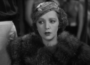 Movie still from “42nd Street” (1933), directed by Lloyd Bacon – An old photo of a woman in a fur coat; Close Up shot, High angle