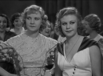 Movie still from “42nd Street” (1933), directed by Lloyd Bacon – A black and white photo of two women; Close Up shot, High angle
