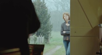 Movie still from “45 Years” (2015), directed by Andrew Haigh – An older woman standing on a dirt path; Medium shot, Over the shoulder angle