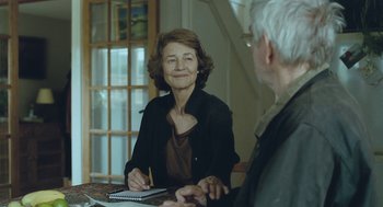 Movie still from “45 Years” (2015), directed by Andrew Haigh – An older man and woman sitting at a table; Medium shot, Over the shoulder angle
