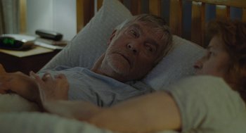 Movie still from “45 Years” (2015), directed by Andrew Haigh – An older man laying in a hospital bed; Close Up shot, Over the shoulder angle