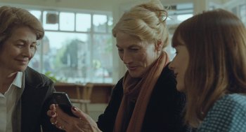 Movie still from “45 Years” (2015), directed by Andrew Haigh – Two women are looking at a cell phone; Close Up shot, Over the shoulder angle