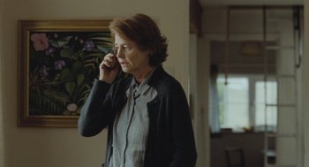 Movie still from “45 Years” (2015), directed by Andrew Haigh – An older woman talking on a cell phone; Medium shot, Over the shoulder angle