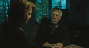 Movie still from “45 Years” (2015), directed by Andrew Haigh – A man and a woman sitting at a table; Medium shot, Over the shoulder angle