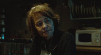 Movie still from “45 Years” (2015), directed by Andrew Haigh – An older woman sitting in front of a mirror; Close Up shot, Over the shoulder angle