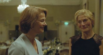Movie still from “45 Years” (2015), directed by Andrew Haigh – Two women standing next to each other in a room; Close Up shot, Over the shoulder angle