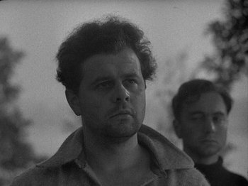 Movie still from “49th Parallel” (1941), directed by Michael Powell – A black - and - white photo of a man with a beard; Close Up shot, Low angle