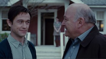 Movie still from “50/50” (2011), directed by Jonathan Levine – Two men standing next to each other on a porch; Close Up shot, Over the shoulder angle