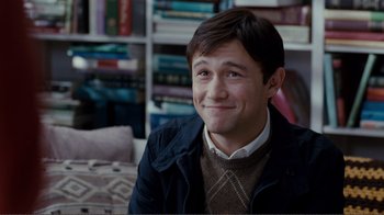 Movie still from “50/50” (2011), directed by Jonathan Levine – A man sitting in front of a book shelf; Close Up shot, Over the shoulder angle