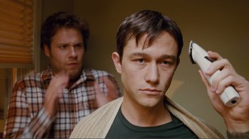 Movie still from “50/50” (2011), directed by Jonathan Levine – A man standing next to another man in front of a mirror; Close Up shot, Over the shoulder angle