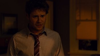 Movie still from “50/50” (2011), directed by Jonathan Levine – A man wearing a striped shirt and a red tie; Close Up shot, Over the shoulder angle
