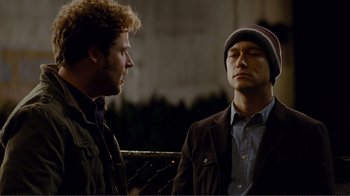 Movie still from “50/50” (2011), directed by Jonathan Levine – Two men standing next to each other on a bridge; Medium shot, Over the shoulder angle