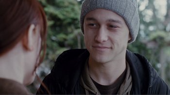 Movie still from “50/50” (2011), directed by Jonathan Levine – A young man wearing a hat and a jacket; Close Up shot, Over the shoulder angle