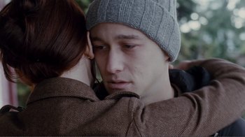 Movie still from “50/50” (2011), directed by Jonathan Levine – A man and a woman hugging each other; Close Up shot, Over the shoulder angle