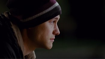Movie still from “50/50” (2011), directed by Jonathan Levine – A person wearing a hat; Close Up shot, Over the shoulder angle