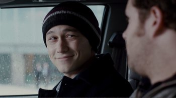 Movie still from “50/50” (2011), directed by Jonathan Levine – A man in a black jacket and a black and white hat; Close Up shot, Over the shoulder angle