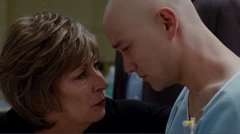 Movie still from “50/50” (2011), directed by Jonathan Levine – An older woman and a younger man face to face; Close Up shot, Over the shoulder angle