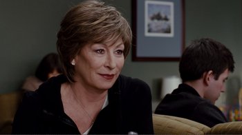 Movie still from “50/50” (2011), directed by Jonathan Levine – A person sitting at a table; Close Up shot, Over the shoulder angle