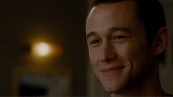 Movie still from “50/50” (2011), directed by Jonathan Levine – A man smiling for the camera; Close Up shot, Over the shoulder angle