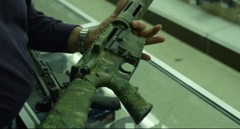 Movie still from “600 Miles” (2015), directed by Gabriel Ripstein – A person holding a gun in their hand; Extreme Close Up shot, High angle