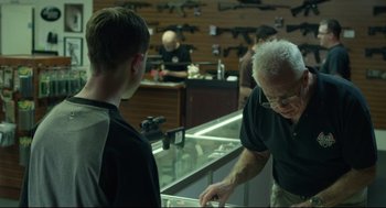 A man in a black t - shirt and a man in a black shirt