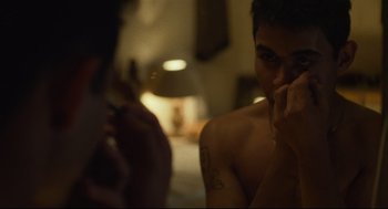 Movie still from “600 Miles” (2015), directed by Gabriel Ripstein – A man sitting in front of another man with a cigarette in his mouth; Extreme Close Up shot, Over the shoulder angle