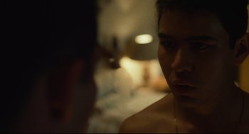 Movie still from “600 Miles” (2015), directed by Gabriel Ripstein – A young man is looking at the camera; Close Up shot, Over the shoulder angle
