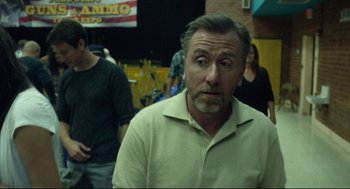 Movie still from “600 Miles” (2015), directed by Gabriel Ripstein – A person wearing a shirt; Close Up shot, Over the shoulder angle