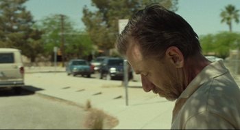 Movie still from “600 Miles” (2015), directed by Gabriel Ripstein – A person on the side of the street; Close Up shot, Low angle