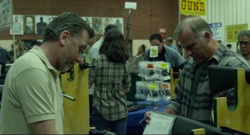 Movie still from “600 Miles” (2015), directed by Gabriel Ripstein – A group of people standing around a room; Medium shot, Over the shoulder angle