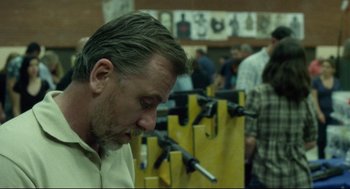 Movie still from “600 Miles” (2015), directed by Gabriel Ripstein – A person with a gun in a room; Close Up shot, Over the shoulder angle