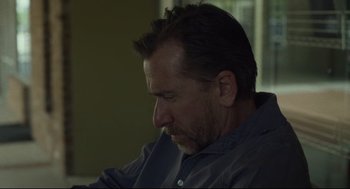 Movie still from “600 Miles” (2015), directed by Gabriel Ripstein – A person wearing a gray shirt; Close Up shot, Low angle