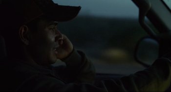 Movie still from “600 Miles” (2015), directed by Gabriel Ripstein – A man sitting in the driver's seat of a car at night; Close Up shot, Low angle
