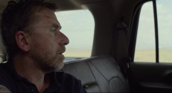 Movie still from “600 Miles” (2015), directed by Gabriel Ripstein – A person sitting in a car; Close Up shot, Over the shoulder angle